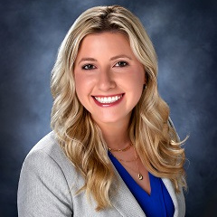 Emily Juranas of Treasury Management in a suit