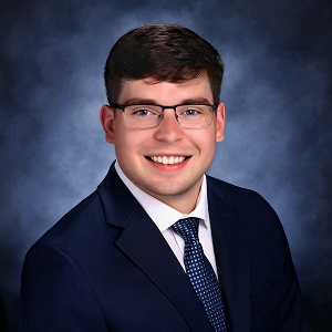 Austin Nelson in a suit and tie