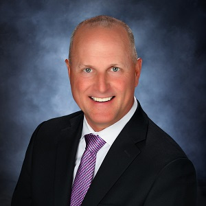 John in a suit and tie