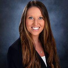 Kelly Warren of Treasury Management in a suit